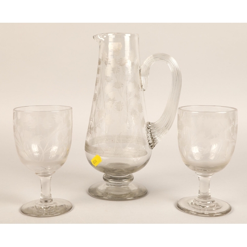 226 - Etched glass jug with two glasses.