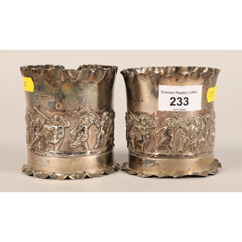 233 - Pair silver beakers decorated with cherubs.weight 200 grams