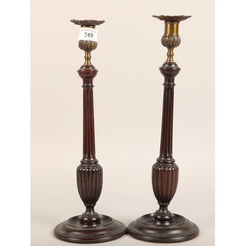 249 - Pair of Georgian style mahogany candlesticks 37cm high