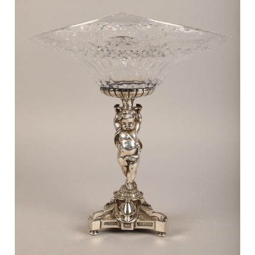 268 - Cut-glass oval table centrepiece, raised on EPNS base, in the form of putti, 30cm high.