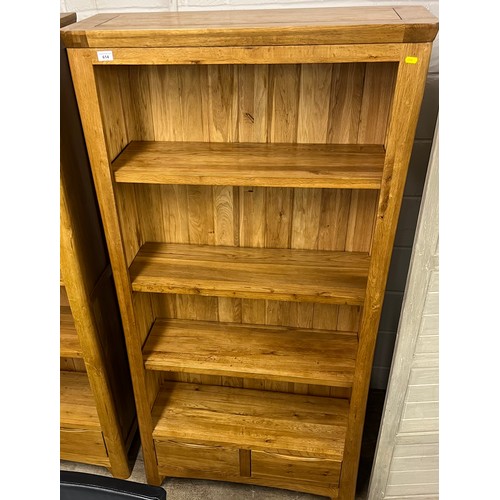 614 - Contemporary oak bookcase over two fitted drawers