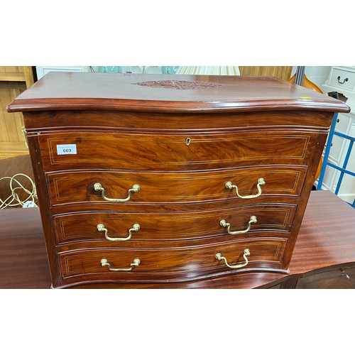 669 - Rosewood chest with lift top and three fitted drawers, carved leaf detail to top