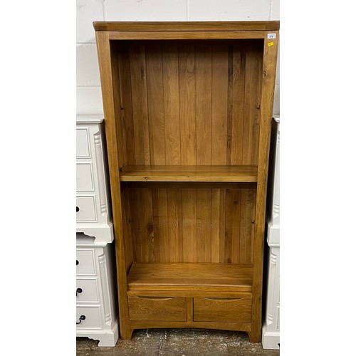 678 - Contemporary oak book case with two fitted drawers