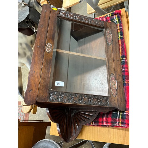 682 - Oak wall mounted corner cabinetcabinet, glazed with carved and brass details