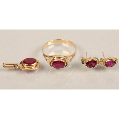 134 - Yellow metal red gem set earrings, ring, and pendant