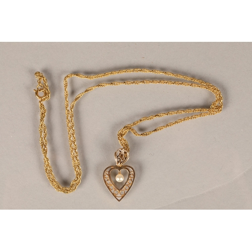 148 - Ladies 9 ct gold seed pearl pendant & rolled gold chain .total weight4.6 grams