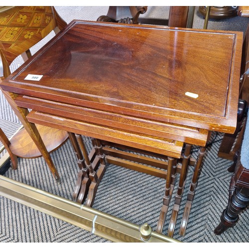 580 - Nest of three mahogany tables 