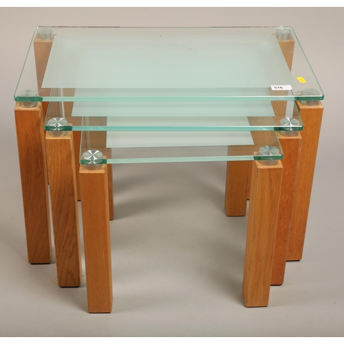 516 - Nest of three contemporary glass topped tables, highest, 40 cm