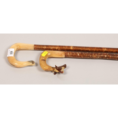 528 - Two walking sticks with horn handles (2)