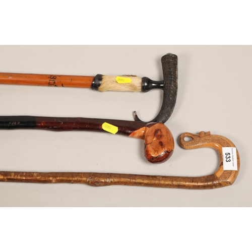 533 - Three walking sticks , including handle carved a thistle (3)