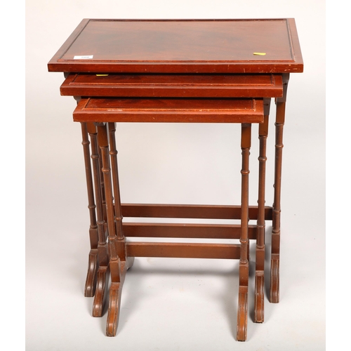 580 - Nest of three mahogany tables 