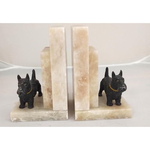 365 - Pair of Art Deco alabaster book ends with cold painted spelter Scottish Terrier figures.18 cm high.