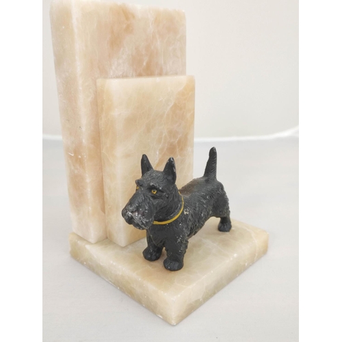 365 - Pair of Art Deco alabaster book ends with cold painted spelter Scottish Terrier figures.18 cm high.