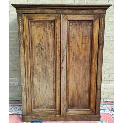 412 - Edwardian inlaid mahogany wardrobe with moulded cornice above two panelled doors on plinth base. app... 