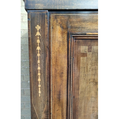 412 - Edwardian inlaid mahogany wardrobe with moulded cornice above two panelled doors on plinth base. app... 