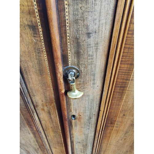 412 - Edwardian inlaid mahogany wardrobe with moulded cornice above two panelled doors on plinth base. app... 