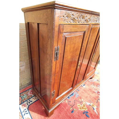 425 - Antique oak hall cupboard, the frieze bearing date 1709 over a pair of panelled doors, on bracket fe... 