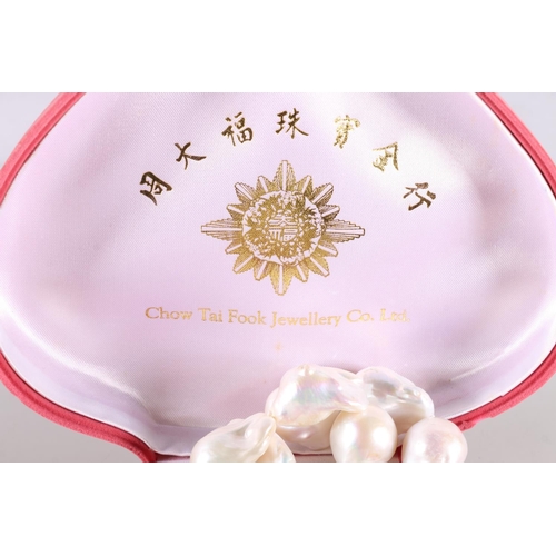 174 - Baroque pearl necklace and matching earrings in pink box by Chow Tai Fook Jewellery Co Ltd. 