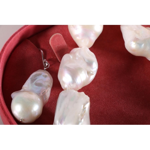 174 - Baroque pearl necklace and matching earrings in pink box by Chow Tai Fook Jewellery Co Ltd. 