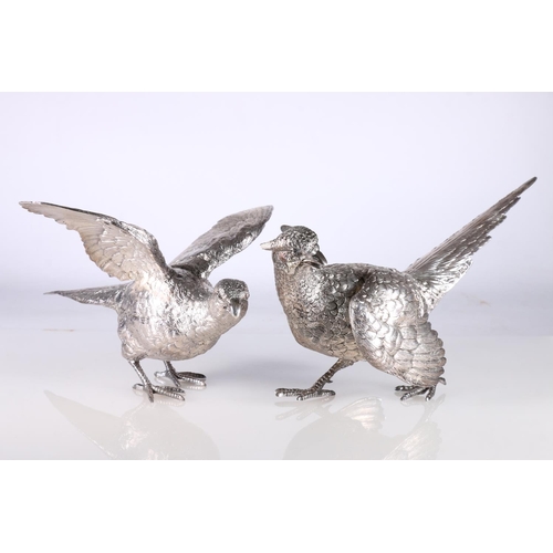 24 - Pair of hollow cast silver table models of pheasants, by C J Vander Ltd, London 1969, 30cm long, 167... 