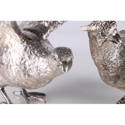 24 - Pair of hollow cast silver table models of pheasants, by C J Vander Ltd, London 1969, 30cm long, 167... 