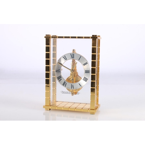 379 - Jaeger Le Coultre mantle clock with floating chapter ring and visible works, gilt metal case, the ba... 