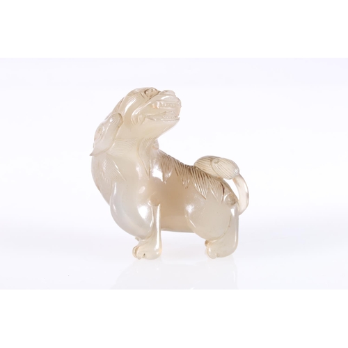 483 - Chinese jade carving of a lion dog, unsigned, 7cm tall, 7cm long. 