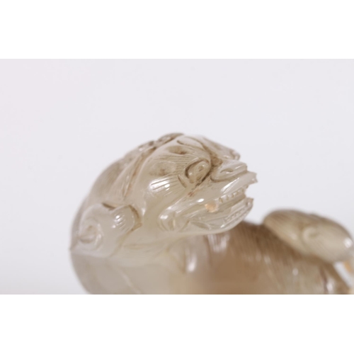 483 - Chinese jade carving of a lion dog, unsigned, 7cm tall, 7cm long. 