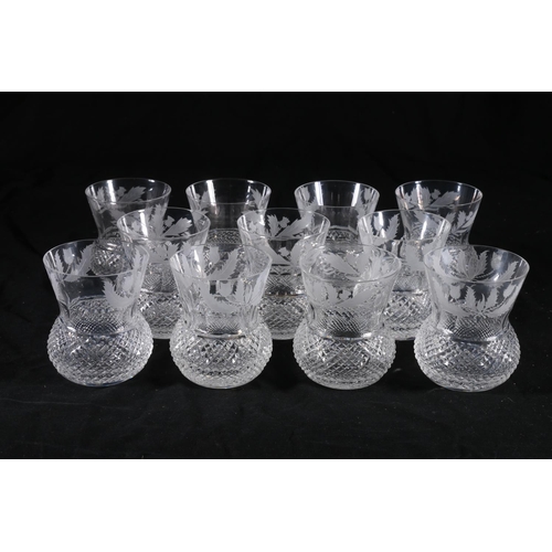 387 - Set of eleven Edinburgh Crystal thistle shaped drinking glasses with etched thistle pattern, having ... 