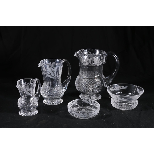 397 - Graduated set of three Edinburgh Crystal thistle pattern jugs of thistle shape with hobnail cut bodi... 