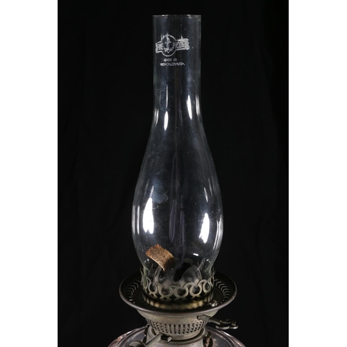 401 - Antique glass oil lamp having amethyst hued glass base and reservoir, with Hinks's No2 Duplex wick w... 