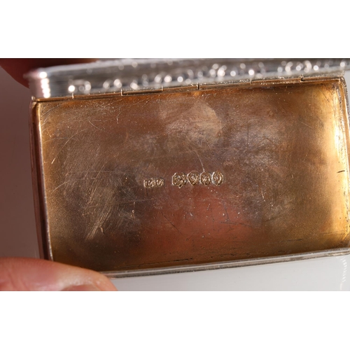 38 - Victorian parcel gilt silver snuff box of rectangular form, the hinged cover decorated with a relief... 