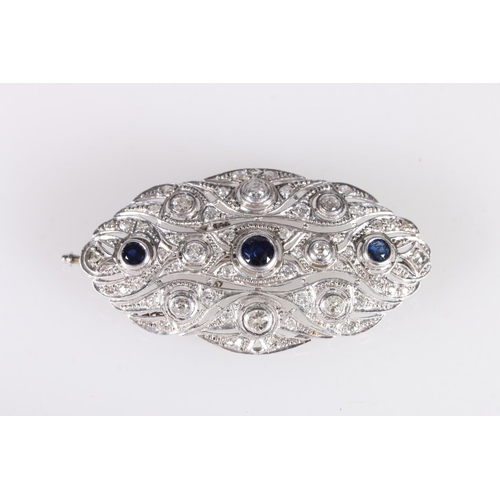 179 - Platinum diamond and sapphire brooch of oval form with pierced body, set with eight rub over collet ... 