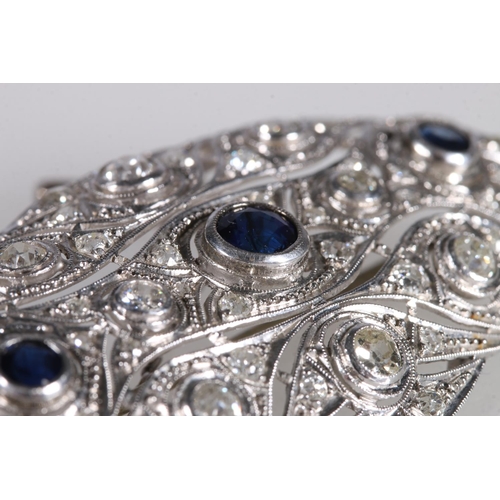 179 - Platinum diamond and sapphire brooch of oval form with pierced body, set with eight rub over collet ... 