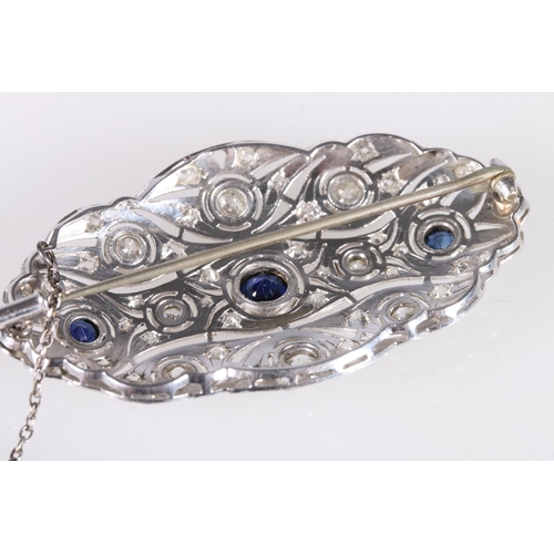 179 - Platinum diamond and sapphire brooch of oval form with pierced body, set with eight rub over collet ... 