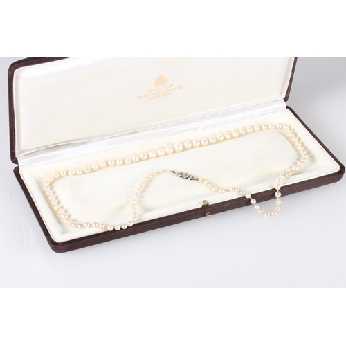 196 - Single strand graduated pearl necklace with 9ct white gold closure set with small diamond, 57cm long... 