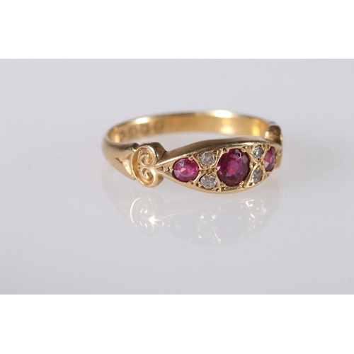 197 - 18ct gold gem set dress ring set with rubies and diamonds, ring size O, 3.9g.