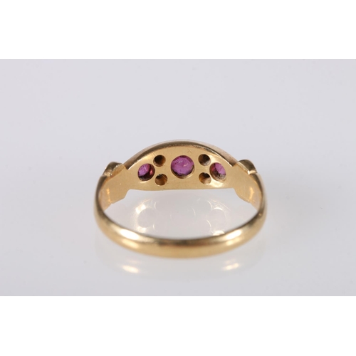 197 - 18ct gold gem set dress ring set with rubies and diamonds, ring size O, 3.9g.