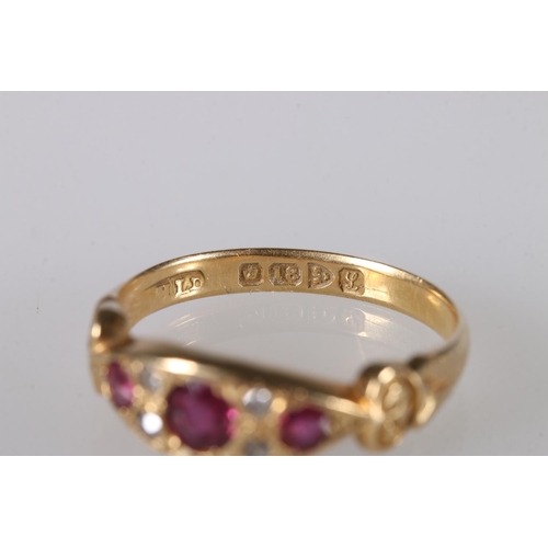 197 - 18ct gold gem set dress ring set with rubies and diamonds, ring size O, 3.9g.