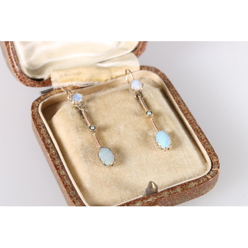 198 - Pair of 9ct gold pendant drop earrings set with opals, 3.2cm long, 1.8g gross.