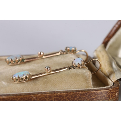 198 - Pair of 9ct gold pendant drop earrings set with opals, 3.2cm long, 1.8g gross.