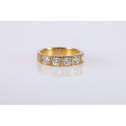 200 - Unhallmarked yellow metal dress ring set with five 0.2ct diamonds, ring size L/M, 5.4g gross.