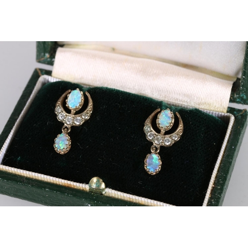 201 - Pair of yellow metal pendant earrings of crescent moon shape set with diamonds and opals, 2.2g gross... 