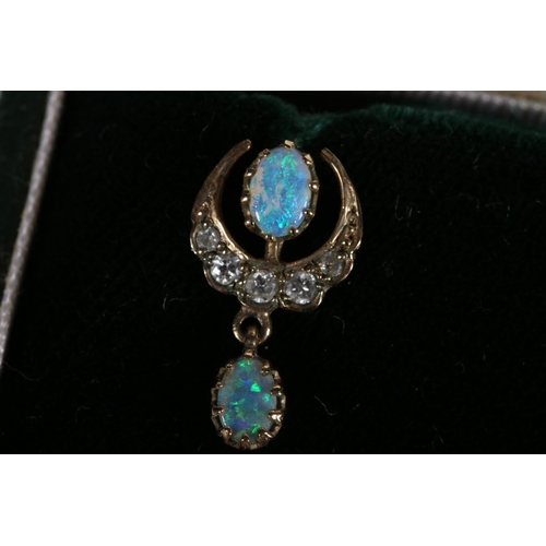 201 - Pair of yellow metal pendant earrings of crescent moon shape set with diamonds and opals, 2.2g gross... 