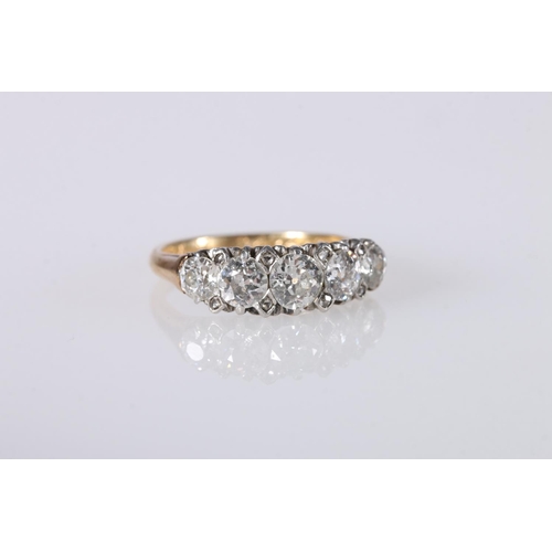 203 - 18ct yellow gold diamond set ring, the central diamond approximately 0.5ct flanked by 0.4ct and 0.2c... 