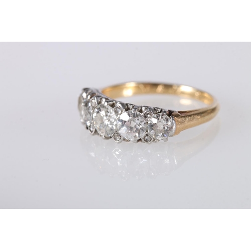 203 - 18ct yellow gold diamond set ring, the central diamond approximately 0.5ct flanked by 0.4ct and 0.2c... 