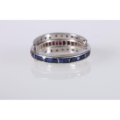 209 - Unhallmarked white metal, likely platinum dress ring, the central band with square faceted sapphire ... 