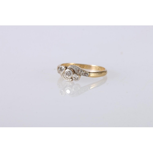 226 - 18ct yellow gold and platinum diamond set dress ring, the three larger diamonds in a crossover setti... 