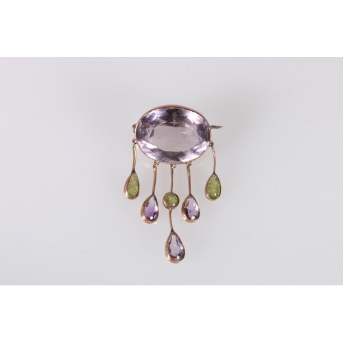 230 - Antique yellow metal mounted amethyst and peridot pendant brooch, the large faceted oval pale amethy... 