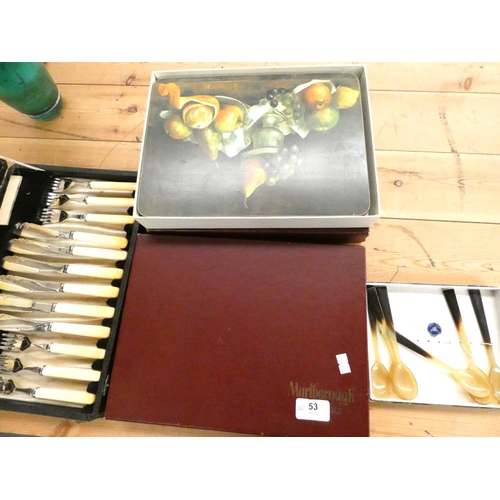 53 - Set of bone handle cutlery, two boxes of place mats and horn spoons.